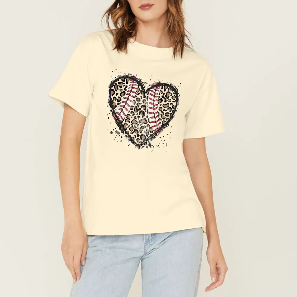 A Heart-Shaped Pattern With Baseball Stitching Elements Inside And Leopard Print, And Some Ink Splash Effects Around It, A Simple, Casual T-Shirt.