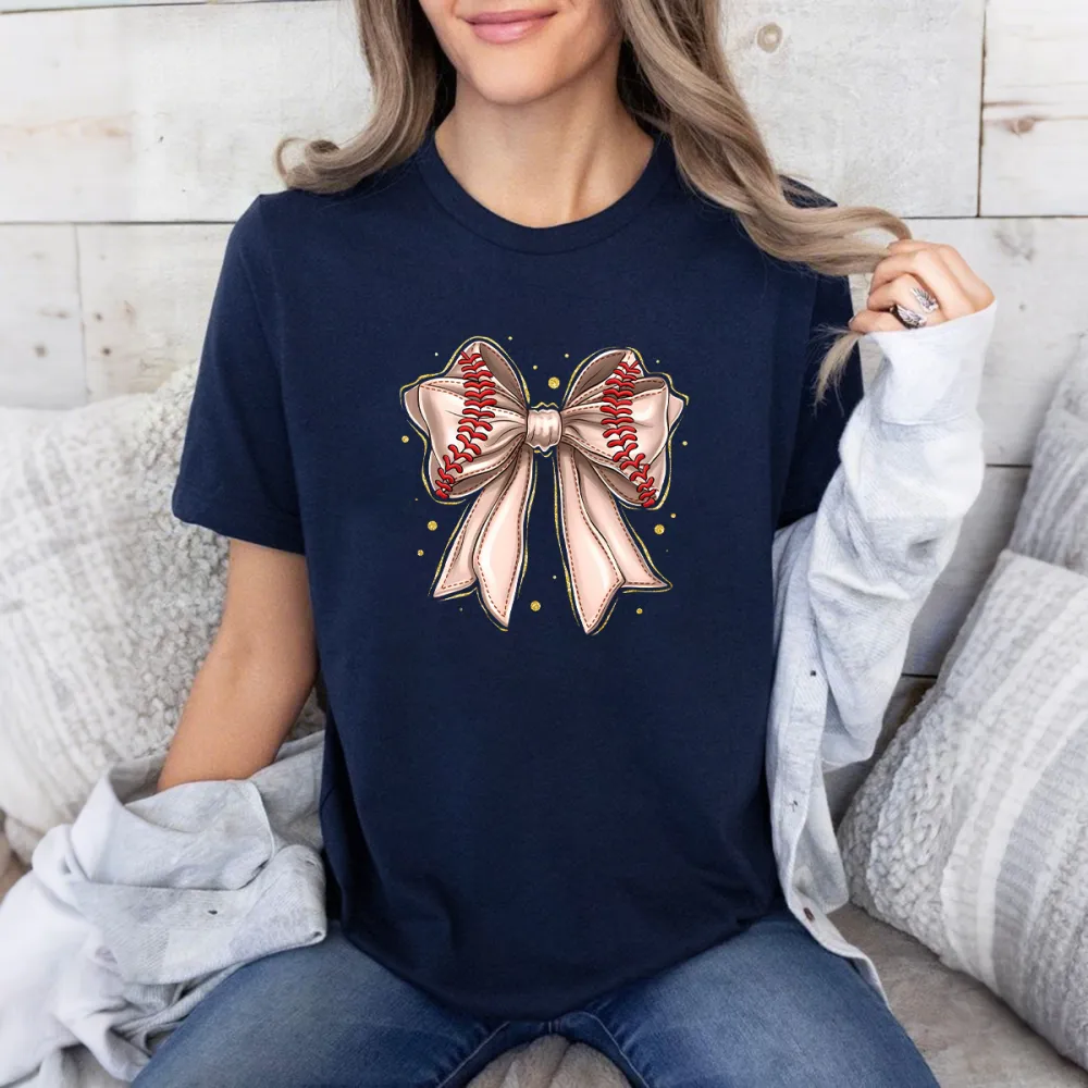 A Casual T-Shirt With A Light Pink Bow And Red Baseball Stitching On The Two Straps.