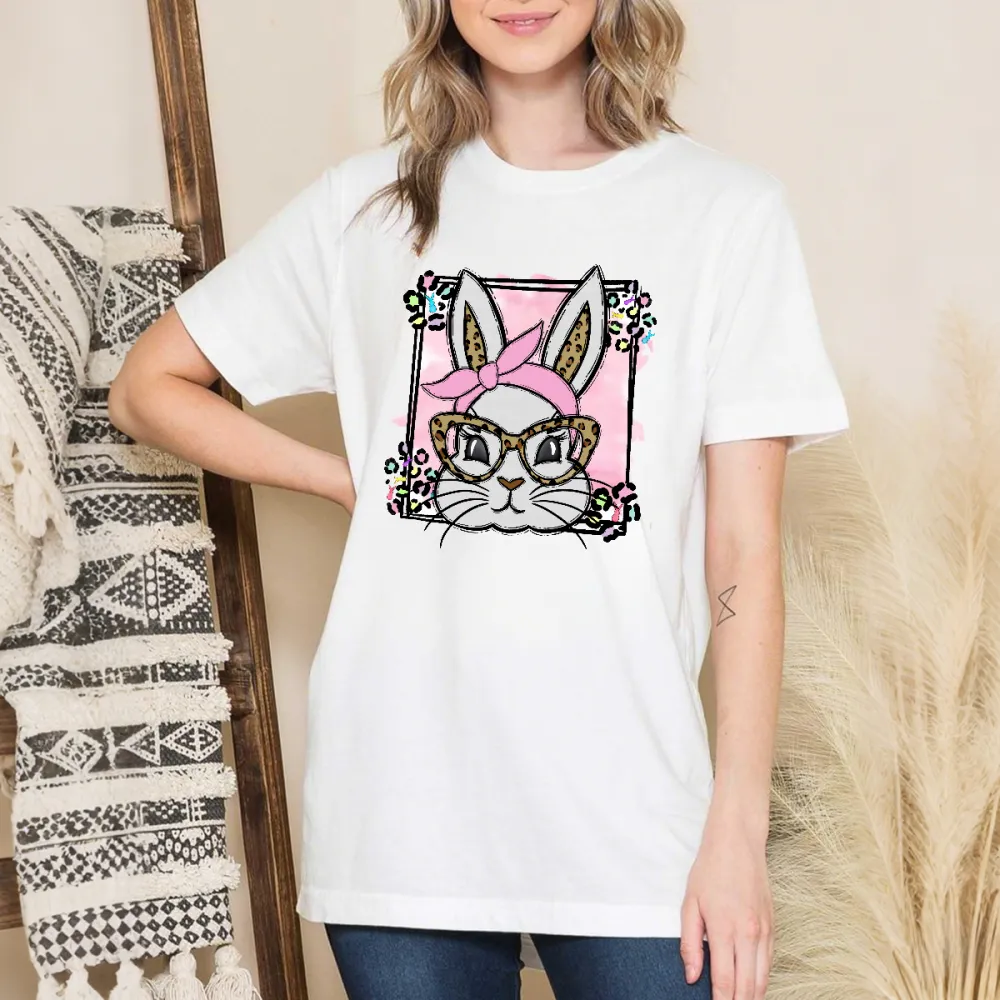 A Cartoon Rabbit Image. The Rabbit Is Wearing A Pink Headscarf, Leopard Print Glasses, A Pink Checkered Background, Colorful Flowers Around, And A Casual T-Shirt.