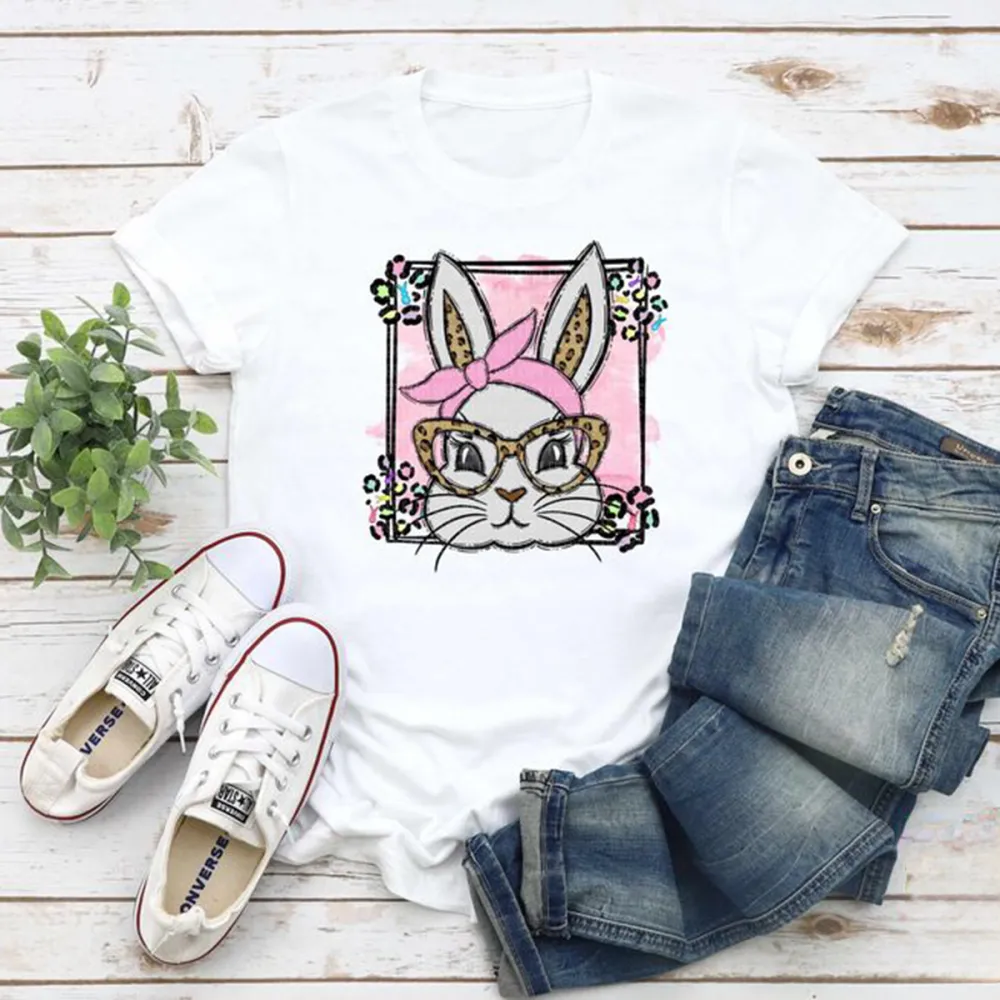 A Cartoon Rabbit Image. The Rabbit Is Wearing A Pink Headscarf, Leopard Print Glasses, A Pink Checkered Background, Colorful Flowers Around, And A Casual T-Shirt.