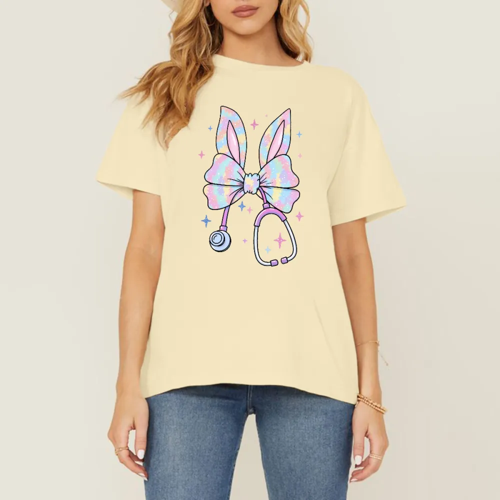 A Bow Pattern With Bunny Ears, With Gradient Effects Of Pink, Blue, Purple And Other Colors On The Bow And Ears, A Stethoscope, And Stars Dotted Around It, Cute Style, Childlike, Casual T-Shirt