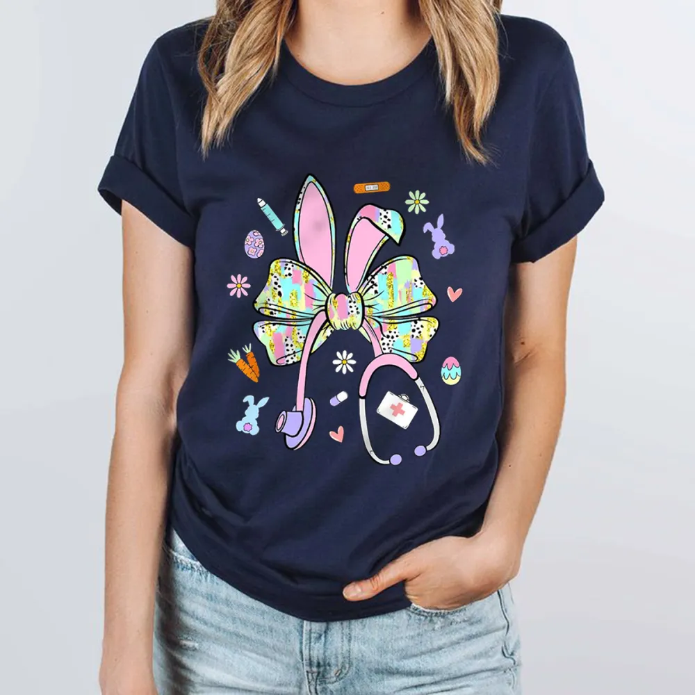 A Bow Pattern With Rabbit Ears, Patterns Of Various Colors On The Bow And Ears, Pencils, Rabbits, Small Flowers, Eggs, Stethoscopes, Heart Shapes, Full Of Childlike Fun, Casual T-Shirt