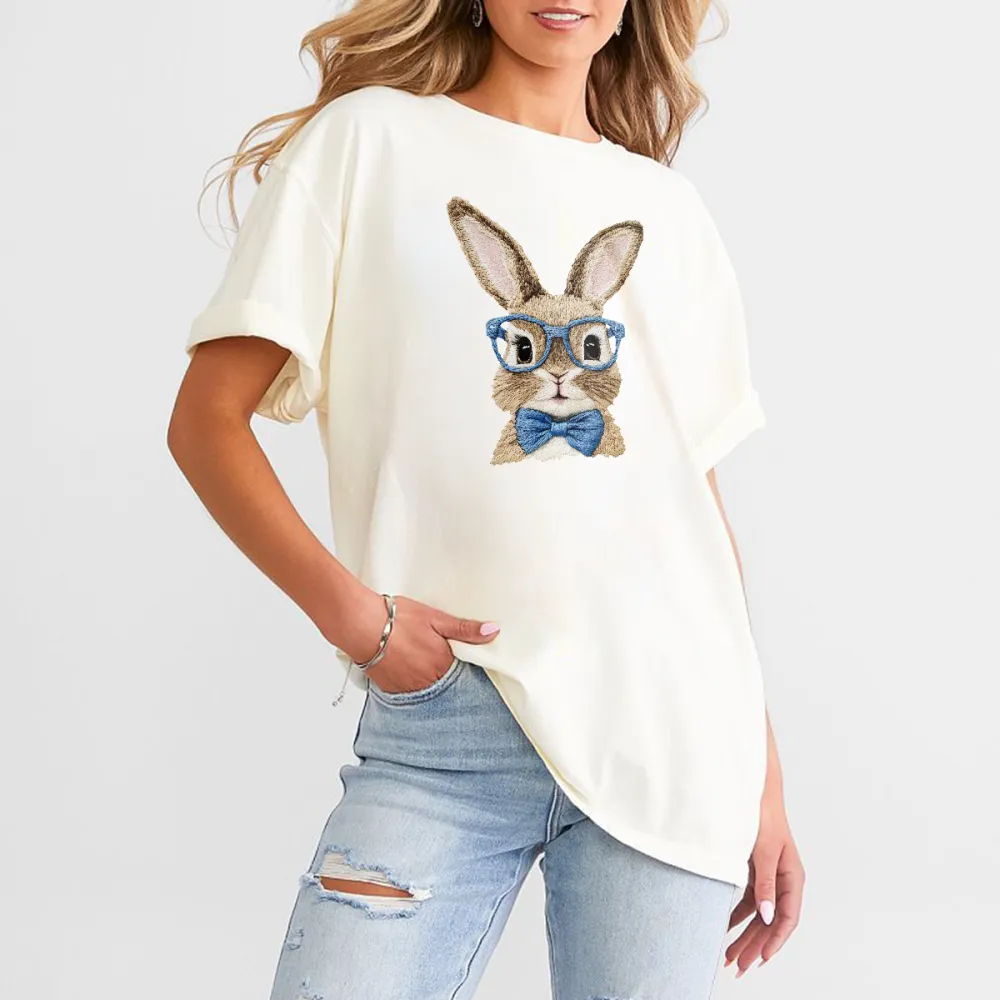 A Rabbit Pattern Wearing Blue Glasses And A Blue Bow Tie Looks Cute And Stylish On A Casual T-Shirt.