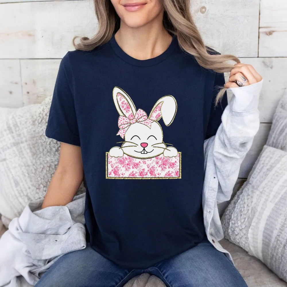 A Cute Cartoon Rabbit Pattern, The Rabbit Is Wearing A Pink Floral Bow, With Its Two Front Paws Resting On A Pink Floral Sign, Casual T-Shirt