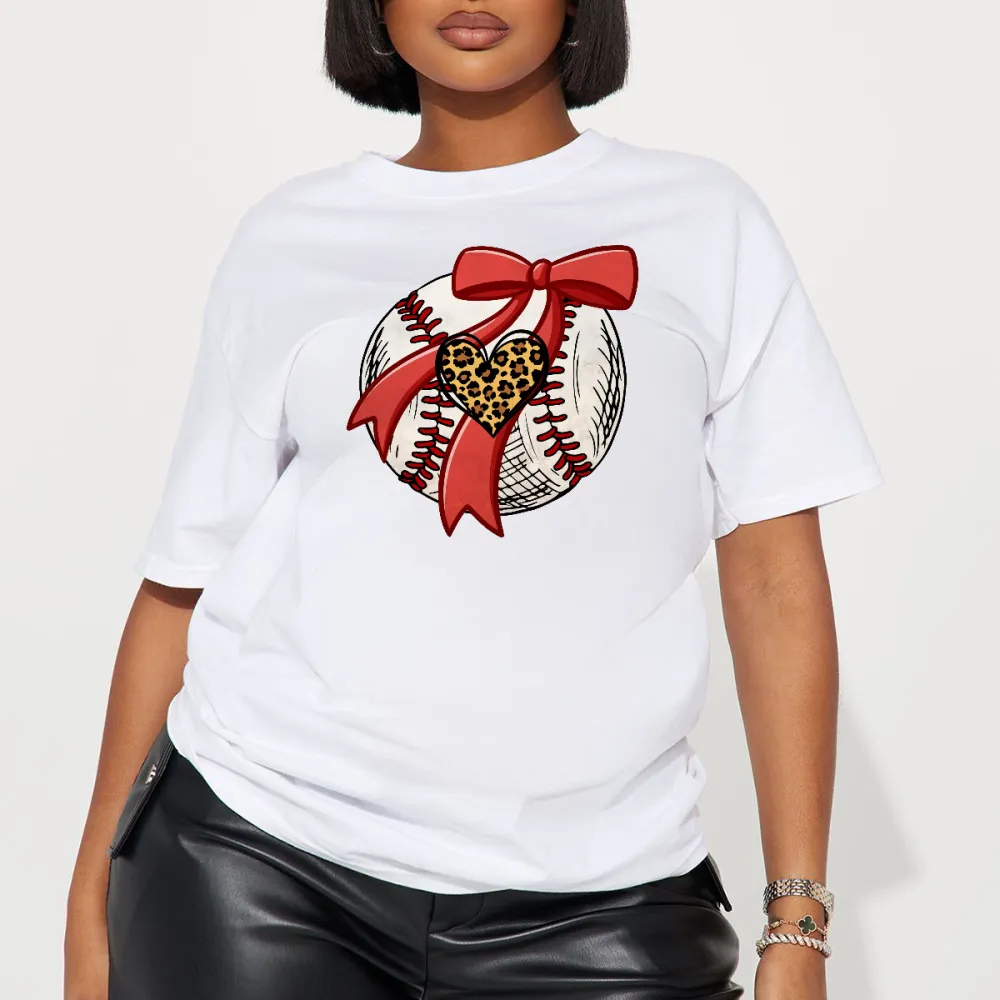 A Pattern Combining A Stitched Baseball, A Red Bow And A Leopard Print Heart. There Is Also A Leopard Print Heart Pattern On The Ball, A Casual T-Shirt.