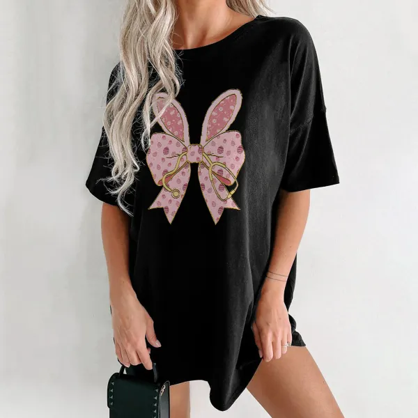 A Pink Bow Pattern With Bunny Ears And Pink Polka Dots, Hanging On A Golden Stethoscope And A Casual T-Shirt.