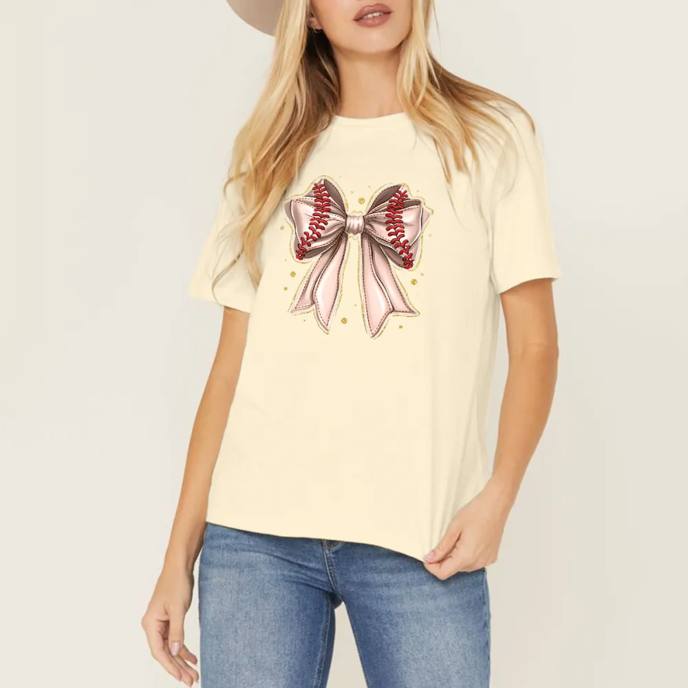 A Casual T-Shirt With A Light Pink Bow And Red Baseball Stitching On The Two Straps.