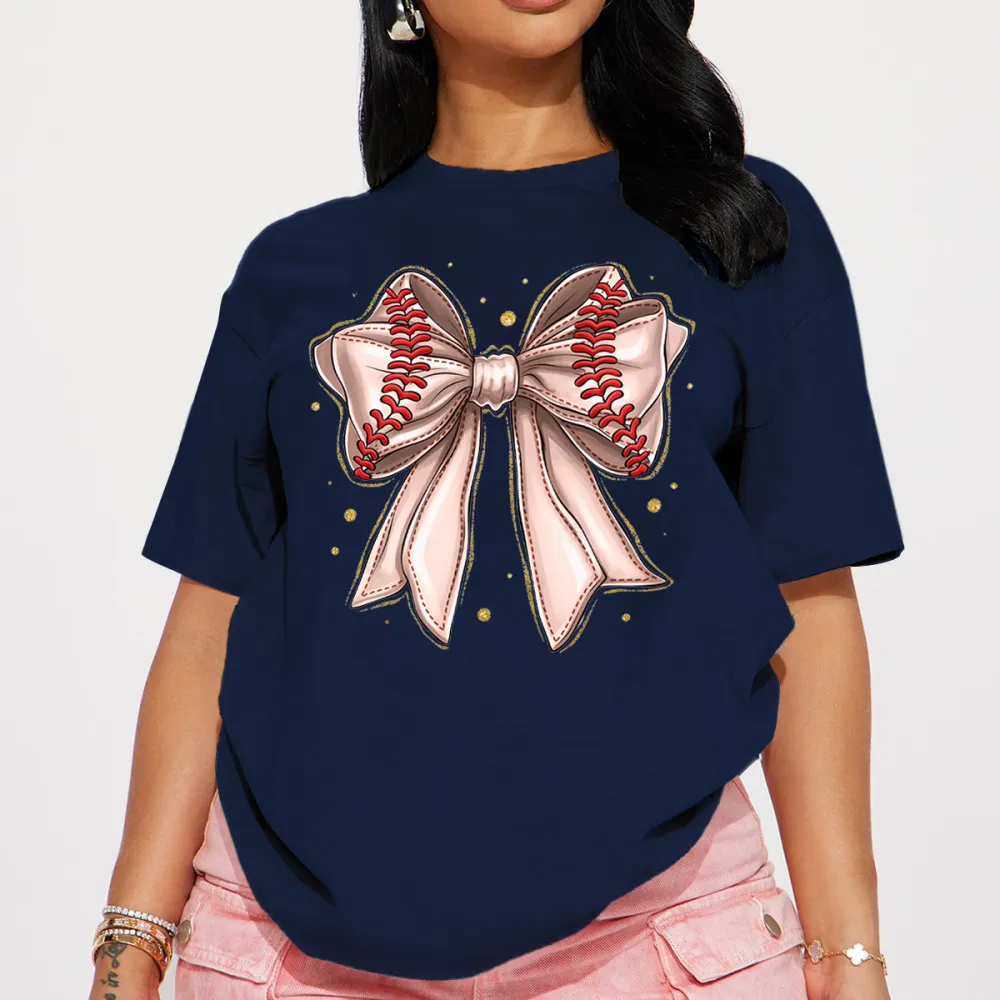 A Light Pink Bow Pattern With Red Baseball-Like Stitching Elements On The Edge Of The Bow And Some Gold Dots Around It, A Casual T-Shirt.