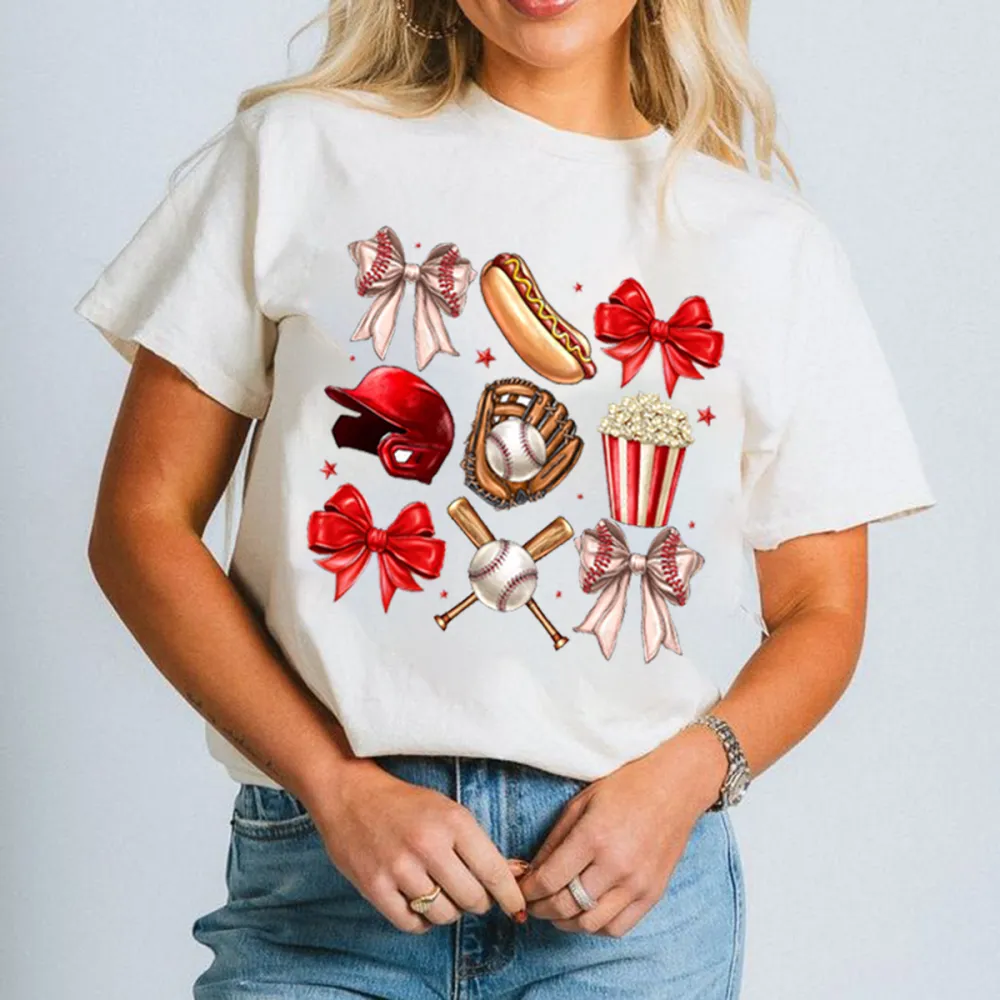 A Casual T-Shirt With A Red And Red And White Patterned Bow Tie, A Red Baseball Helmet, A Baseball Glove, A Baseball, Crossed Baseball Bats, A Hot Dog And A Popcorn Bucket.