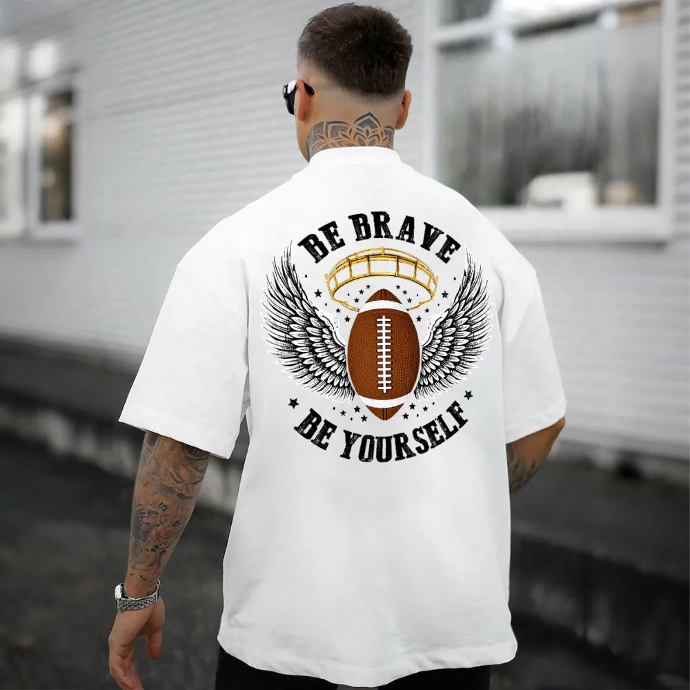 There Are Wings On Both Sides Of The Football, The Outline Of A Football Helmet, And The Words 