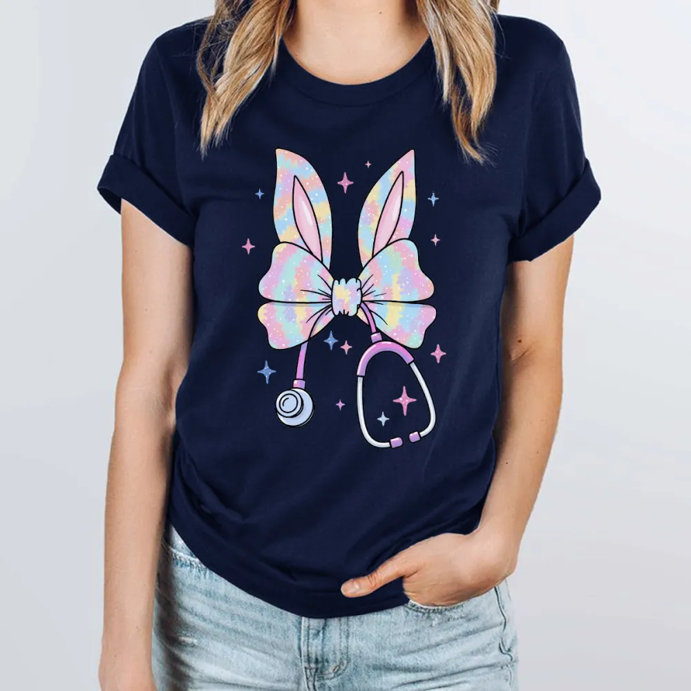A Bow Pattern With Bunny Ears, With Gradient Effects Of Pink, Blue, Purple And Other Colors On The Bow And Ears, A Stethoscope, And Stars Dotted Around It, Cute Style, Childlike, Casual T-Shirt
