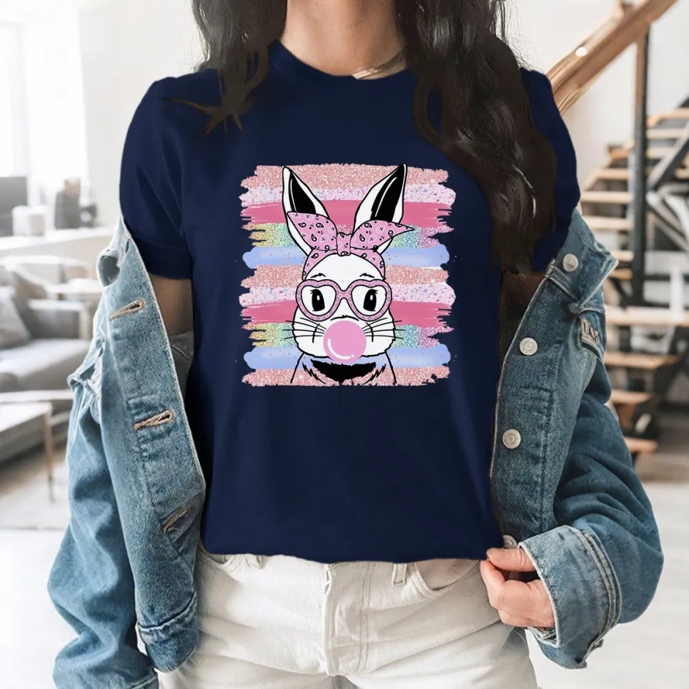 The Pattern Of A Rabbit Wearing A Pink Bow And Glasses, Blowing Pink Bubble Gum In His Mouth, With Colorful Striped Brushstrokes In The Background, Playful And Lively Style, Casual T-Shirt.