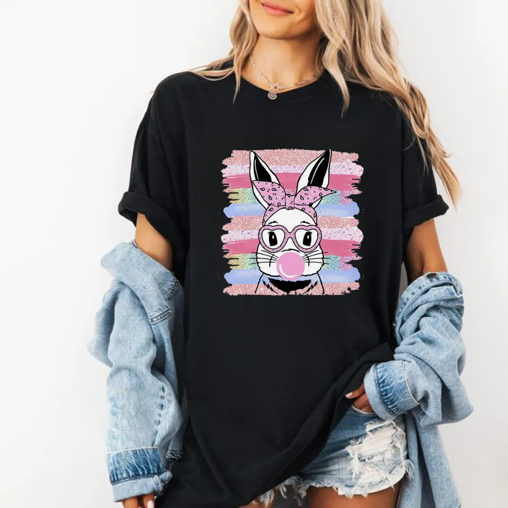 The Pattern Of A Rabbit Wearing A Pink Bow And Glasses, Blowing Pink Bubble Gum In His Mouth, With Colorful Striped Brushstrokes In The Background, Playful And Lively Style, Casual T-Shirt.