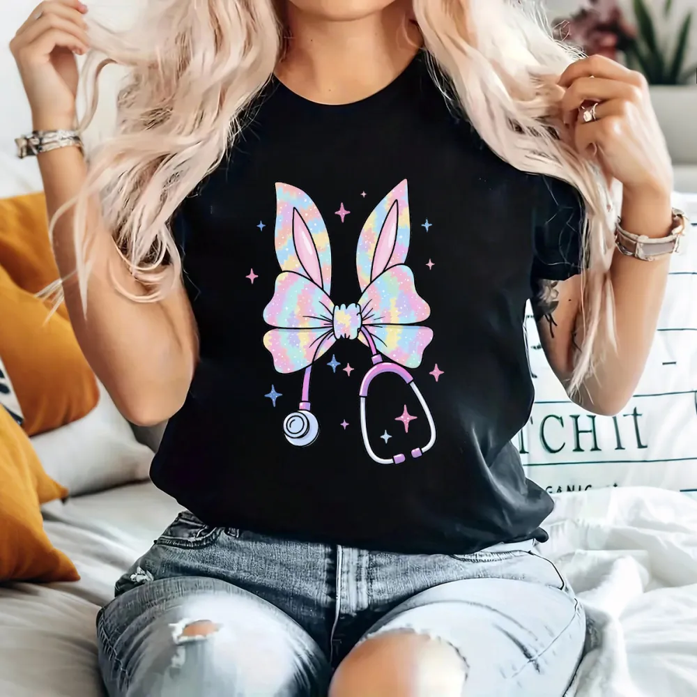 A Bow Pattern With Bunny Ears, With Gradient Effects Of Pink, Blue, Purple And Other Colors On The Bow And Ears, A Stethoscope, And Stars Dotted Around It, Cute Style, Childlike, Casual T-Shirt