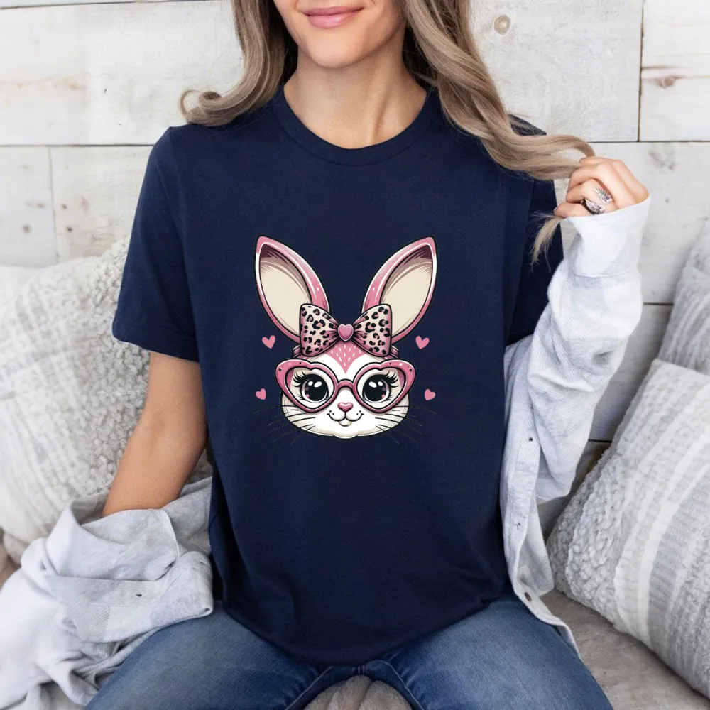 A Cartoon Rabbit Head Pattern, Wearing A Leopard Print Bow And Heart-Shaped Glasses, Surrounded By Pink Hearts. The Overall Style Is Sweet And Cute, A Casual T-Shirt.
