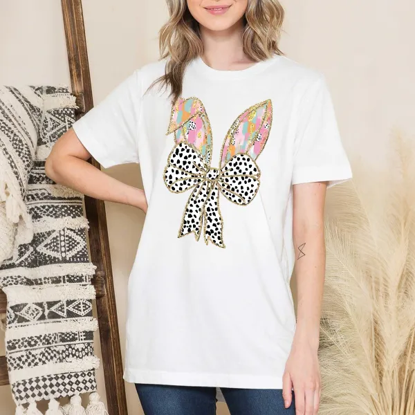 There Are Colorful Geometric Patterns On The Cartoon Rabbit Ears, With Gold Decorations On The Edges And A Big Bow With Black And White Spots, Which Is Lively And Cute, And A Casual T-Shirt.