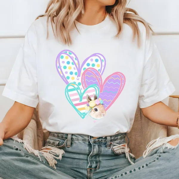 A Cute Little Rabbit, Surrounded By Several Decorative Heart-Shaped Patterns With Different Patterns Such As Polka Dots And Stripes, A Casual T-Shirt.