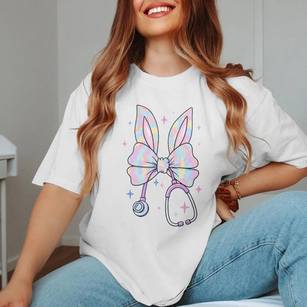 A Bow Pattern With Bunny Ears, With Gradient Effects Of Pink, Blue, Purple And Other Colors On The Bow And Ears, A Stethoscope, And Stars Dotted Around It, Cute Style, Childlike, Casual T-Shirt